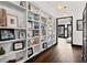 Hallway features custom built-in shelving perfect for displaying art and décor at 90 Bahama Cir, Tampa, FL 33606
