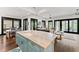 Expansive open-concept kitchen with a large island, seamlessly connected to the dining and living areas at 90 Bahama Cir, Tampa, FL 33606