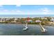 Aerial view of waterfront home with private dock and beach access in a tropical setting at 9048 Wharf Ave, Placida, FL 33946