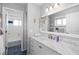 Bathroom with walk-in shower, granite counters, vessel sink, decorative mirror and lighting at 9048 Wharf Ave, Placida, FL 33946