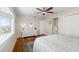 Bright bedroom with hardwood floors and bay window seat overlooking water at 9048 Wharf Ave, Placida, FL 33946