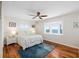 Bright bedroom with wood floors and bay window seat overlooking water at 9048 Wharf Ave, Placida, FL 33946