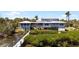 Waterfront home with expansive decks, screened porches, and private boat dock at 9048 Wharf Ave, Placida, FL 33946