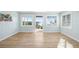 Light blue living room with wood floors and water view at 9048 Wharf Ave, Placida, FL 33946