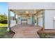 Spacious outdoor area features a wooden deck, a utility area, and a coastal ambiance at 9048 Wharf Ave, Placida, FL 33946