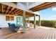 Relaxing outdoor seating area with chairs, a table, and water views at 9048 Wharf Ave, Placida, FL 33946
