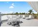 Enjoy panoramic water views from the rooftop deck, perfect for sunbathing and entertaining at 9048 Wharf Ave, Placida, FL 33946