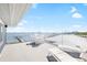 Enjoy panoramic water views from the rooftop deck, perfect for sunbathing and entertaining guests at 9048 Wharf Ave, Placida, FL 33946