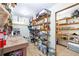 Functional storage room with shelving, work table, and supplies for organization and utility at 9048 Wharf Ave, Placida, FL 33946