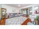 Bright living room featuring hardwood floors, a comfortable sofa, and a decorative rug at 938 16Th N Ave, St Petersburg, FL 33704