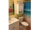 Bathroom features a sink, toilet, and a beach themed shower curtain at 10032 65Th N Ave # 14, St Petersburg, FL 33708