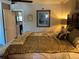 Bedroom featuring a bed with decorative pillows and two open doors at 10032 65Th N Ave # 14, St Petersburg, FL 33708