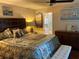 Bedroom featuring a ceiling fan and a bed with decorative pillows and art on the wall at 10032 65Th N Ave # 14, St Petersburg, FL 33708