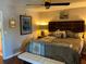 This bedroom features a bed with decorative pillows and paintings on the wall at 10032 65Th N Ave # 14, St Petersburg, FL 33708