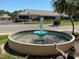 Decorative water fountain in a well-kept neighborhood adding charm and visual appeal at 10032 65Th N Ave # 14, St Petersburg, FL 33708