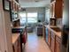 Bright kitchen with stainless appliances, tile backsplash, and an opening to the living room for easy entertaining at 10032 65Th N Ave # 14, St Petersburg, FL 33708