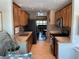 Bright and open kitchen design with stainless appliances and wooden cabinetry offering ample storage and style at 10032 65Th N Ave # 14, St Petersburg, FL 33708