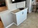 Living room showing white cabinet with stone countertop next to wall at 10032 65Th N Ave # 14, St Petersburg, FL 33708