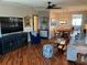 Stylish living room with hardwood floors, comfortable seating, and a view of the dining area creating an inviting space at 10032 65Th N Ave # 14, St Petersburg, FL 33708