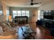 Inviting living room with hardwood floors, a comfortable sofa, and a view of the front door creating a cozy ambiance at 10032 65Th N Ave # 14, St Petersburg, FL 33708