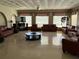 Spacious community lounge with multiple seating areas and a large screen TV for shared entertainment at 10032 65Th N Ave # 14, St Petersburg, FL 33708
