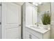 Bathroom features a white vanity with bronze finishes at 11146 Rustic Timber Loop, San Antonio, FL 33576