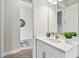 Bright bathroom featuring a modern single vanity with a sink, neutral finishes at 11146 Rustic Timber Loop, San Antonio, FL 33576