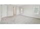 Spacious bedroom features plush carpeting, neutral paint, and a large window, allowing natural light to illuminate the space at 11146 Rustic Timber Loop, San Antonio, FL 33576