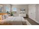 Cozy bedroom with a large window, neutral decor, and modern accents with a closet at 11146 Rustic Timber Loop, San Antonio, FL 33576