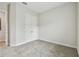 Carpeted bedroom features a double-door closet and neutral wall color at 11146 Rustic Timber Loop, San Antonio, FL 33576