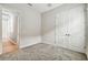 Neutral bedroom with gray carpeting and white trim and doors offers a calming, flexible space at 11146 Rustic Timber Loop, San Antonio, FL 33576