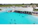 Aerial of a restaurant next to the lagoon where residents can get food and refreshments at 11146 Rustic Timber Loop, San Antonio, FL 33576