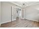 Office with hardwood floors, recessed lighting, chandelier, and light walls with glass french doors at 11146 Rustic Timber Loop, San Antonio, FL 33576
