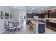 Modern kitchen with granite countertops, stainless steel appliances, and an open layout to the dining area at 11412 Velvet Apricot Dr, Land O Lakes, FL 34638
