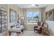 Cozy home office featuring a modern desk, comfortable chair, and natural light at 11415 Velvet Apricot Dr, Land O Lakes, FL 34638