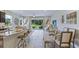 Open floor plan showcasing modern kitchen and dining areas flowing into a cozy living space at 11415 Velvet Apricot Dr, Land O Lakes, FL 34638