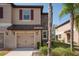 Exterior view featuring a one-car garage and stone accents at 11704 Castine St, New Port Richey, FL 34654