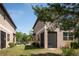Exterior of townhome featuring neutral stucco and screened-in porch at 11704 Castine St, New Port Richey, FL 34654