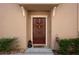 Close-up of the front door adorned with a festive wreath and stylish accents at 11704 Castine St, New Port Richey, FL 34654