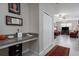 Bright hallway featuring a built-in desk, offering a practical workspace with easy access to living areas at 11704 Castine St, New Port Richey, FL 34654