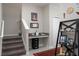 Hallway with stairs, a small desk area, and decor shelving creates a cozy and functional space at 11704 Castine St, New Port Richey, FL 34654