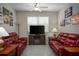 Inviting living room with comfortable seating, natural light, and entertainment center, perfect for relaxation at 11704 Castine St, New Port Richey, FL 34654