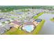 Aerial view of the community featuring a pool, recreational area, and scenic pond at 12916 Brookside Moss Dr, Riverview, FL 33579
