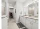 Bathroom featuring double sinks, tile flooring, and a separate shower and closet at 12916 Brookside Moss Dr, Riverview, FL 33579