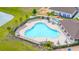 Aerial view of a resort-style community pool, perfect for relaxation and recreation at 12916 Brookside Moss Dr, Riverview, FL 33579