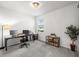 Bright home office space with a large desk, bookshelves and natural light at 12916 Brookside Moss Dr, Riverview, FL 33579