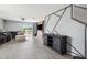 Bright and airy living room featuring sleek floors, comfortable seating, and stylish decorative wall at 14100 Holly Hammock Ln, Brooksville, FL 34613