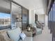 Spacious balcony with seating area offering views of the city, bedroom, and beautiful decor at 1460 Gulf Blvd # 509, Clearwater Beach, FL 33767