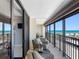 Balcony view featuring outdoor seating and views of the ocean and beach from a high-rise condo at 1460 Gulf Blvd # 509, Clearwater Beach, FL 33767