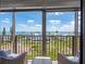 Balcony view of the ocean, beach and neighborhood featuring outdoor seating and clear skies at 1460 Gulf Blvd # 509, Clearwater Beach, FL 33767